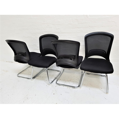 624 - SET OF FOUR OFFICE CHAIRS
with shaped mesh fabric backs above black fabric padded seats, standing on... 