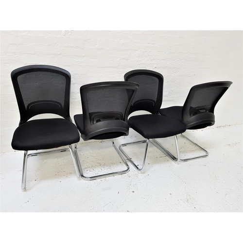 629 - SET OF FOUR OFFICE CHAIRS
with shaped mesh fabric backs above black fabric padded seats, standing on... 