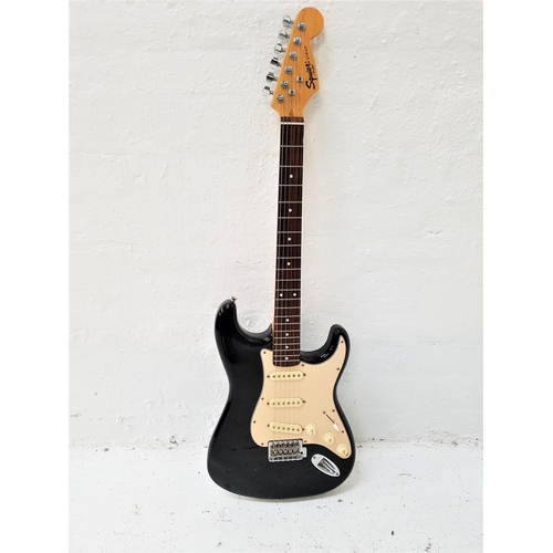 419 - FENDER SQUIER STRAT ELECTRIC GUITAR
with a white and black gloss body, with two tone and a volume di... 