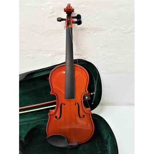 500 - WINDSOR VIOLIN
with a 28cm one piece back and a chin rest, together with a bow and a case