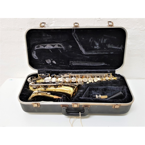 506 - CONN SAXAPHONE
marked N260435, with mother of pearl disc buttons and mouthpiece, in a hard shell cas...