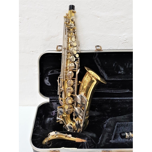 506 - CONN SAXAPHONE
marked N260435, with mother of pearl disc buttons and mouthpiece, in a hard shell cas... 