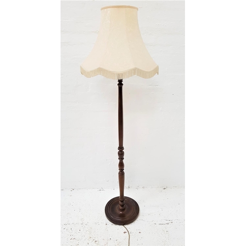 591 - STAINED OAK STANDARD LAMP
raised on a circular base with a turned column and shaped cream shade, 172... 