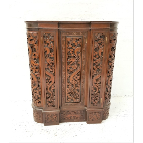 635 - CHINESE TEAK DRINKS CABINET
with a D shaped inverted breakfront with profuse carved decoration, the ... 