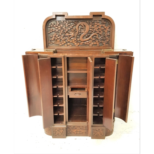 635 - CHINESE TEAK DRINKS CABINET
with a D shaped inverted breakfront with profuse carved decoration, the ... 