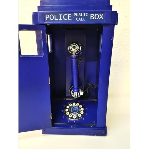 372 - NOVELTY TELEPHONE
styled as an old fashioned Police telephone box, with a phone and keypad, 44cm hig... 