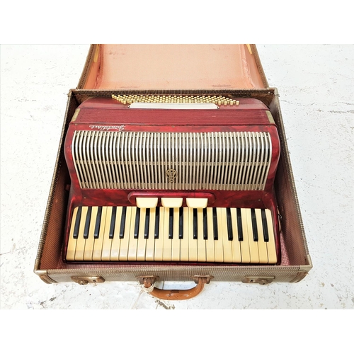 510 - FRONTALINI ACCORDION
with a red marbled body and shoulder strap, cased