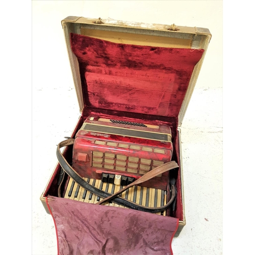 512 - BAILE ACCORDION
with a red marbled body and shoulder strap, cased