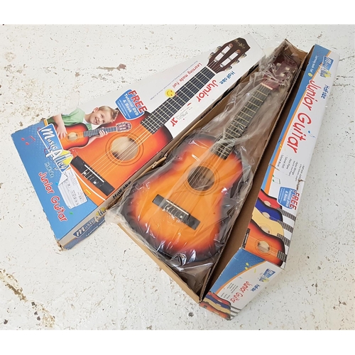 529 - TWO MUSIC ALLEY JUNIOR GUITARS
half size, one with a tutorial DVD, in simulated wood, both boxed (2)