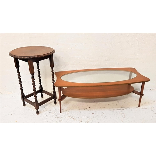 582 - RETRO MAHOGANY SHAPED OCCASIONAL TABLE
with an oval inset glass top above an oval undertier, standin... 