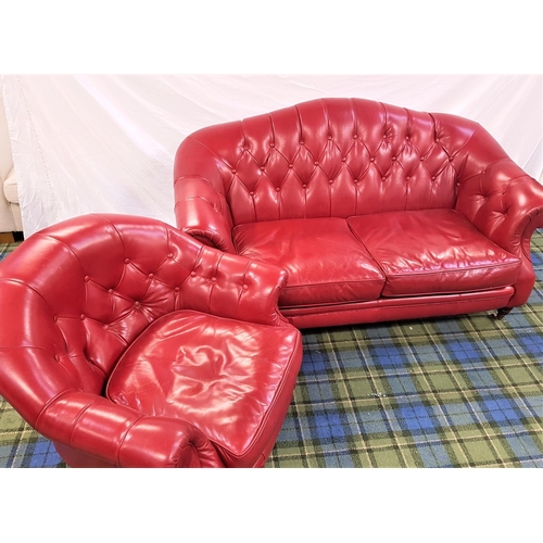 588 - HUMP BACK SOFA
in red leather with button back and arms, standing on turned front supports with bras... 