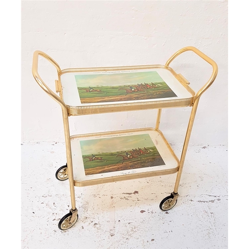 596 - RETRO GILT METAL TROLLEY
with two tiers decorated with the Grand Leicestershire Steeple Chase, the t... 