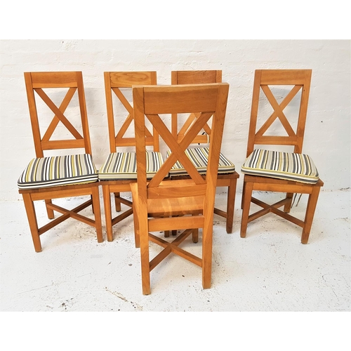 604 - SET OF FIVE LIGHT OAK DINING CHAIRS
with X frame backs above solid seats, standing on tapering suppo... 