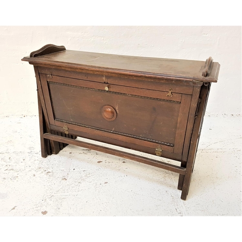 648 - CABINETTA CAMPAIGN BED
with concertina fold out action and a canvas base, with a fold down paneled f... 