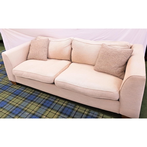 672 - PAIR OF LARGE THREE SEAT SOFAS
in textured cream fabric with two mushroom coloured scatter cushions ... 