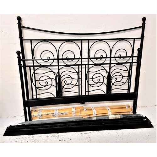 571 - TUBULAR STEEL FRAME DOUBLE BED
with ornate head and footboard, with side rails and slatted wood base... 