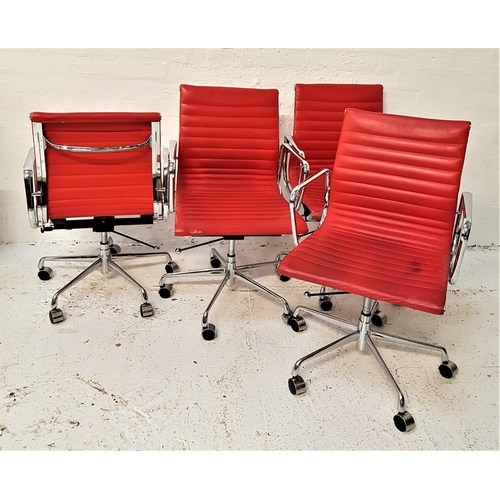 670 - SET OF FOUR RIBBED OFFICE CHAIRS
in red faux leather with chrome arms on an adjustable chrome column... 