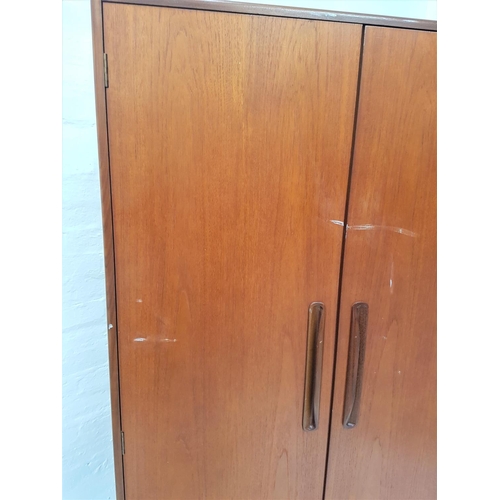 677 - RETRO G PLAN FRESCO TEAK WARDROBE 
having twin doors with lipped and recessed handles, the interior ... 