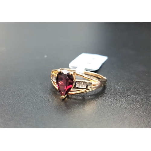 64 - CERTIFIED GARNET AND DIAMOND RING
the central pear cut Rajasthan garnet weighing 1.62cts, flanked by... 