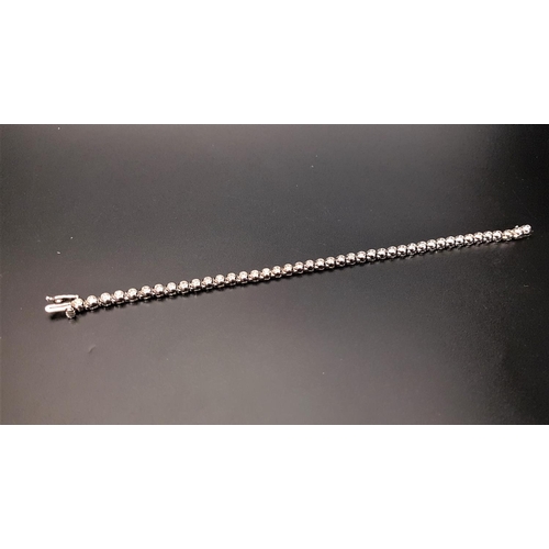 66 - IMPRESSIVE DIAMOND LINE BRACELET
the bezel set diamonds totaling approximately 2cts, in nine carat w... 