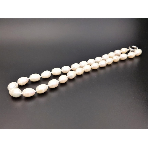 68 - WHITE FRESHWATER BAROQUE PEARL NECKLACE
the individually knotted pearls of ovoid shape, approximatel... 