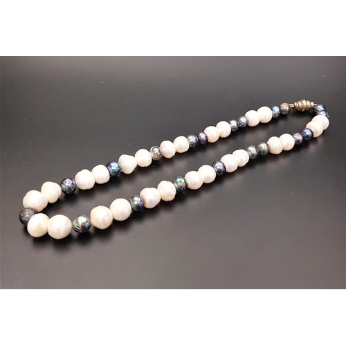 73 - BLACK AND WHITE FRESHWATER BAROQUE PEARL NECKLACE
with magnetic clasp, approximately 45cm long