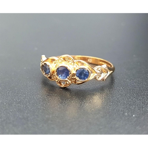 75 - SAPPHIRE THREE STONE RING
on nine carat gold shank with decorative pierced setting, ring size M