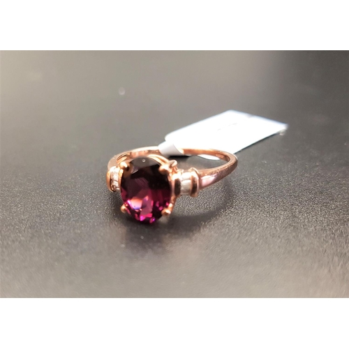 82 - CERTIFIED GARNET AND DIAMOND RING
the central oval cut Rajasthan garnet weighing 2.21cts, flanked by... 