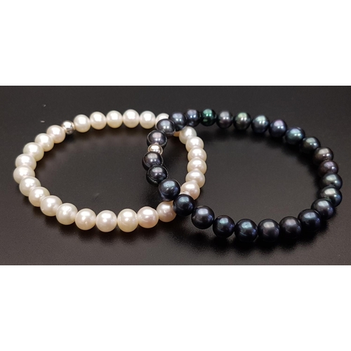 94 - PAIR OF FRESHWATER PEARL BRACELETS
one with black pearls and the other white pearls, both on elastic... 