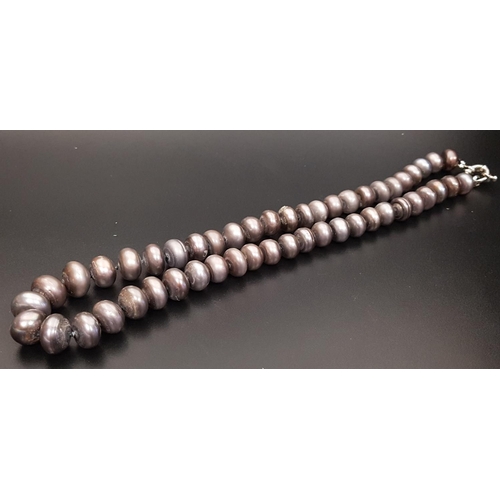 95 - BLACK FRESHWATER PEARL NECKLACE
the individually knotted pearls of button shape, approximately 49cm ... 