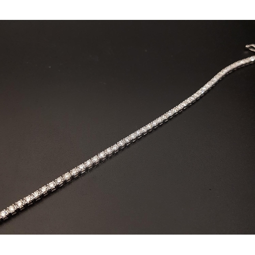 96 - IMPRESSIVE DIAMOND LINE BRACELET
the round brilliant cut diamonds totaling approximately 2.7cts, in ... 