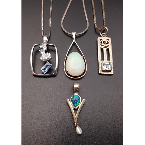 101 - FOUR SILVER PENDANTS
comprising a an opal mosaic and seep pearl pendant; another with simulated opal... 