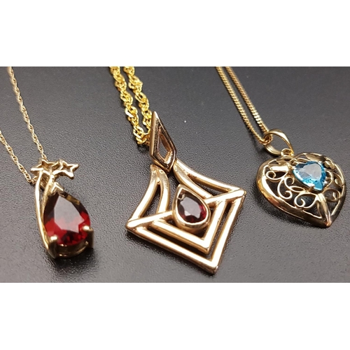 130 - THREE GEM SET GOLD PENDANTS
comprising a pierced garnet set example in nine carat gold, another garn... 