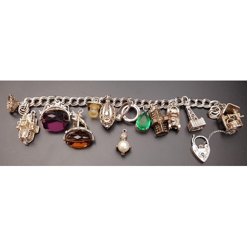 131 - SILVER CHARM BRACELET
with silver double curb link bracelet with silver heart padlock clasp and most... 