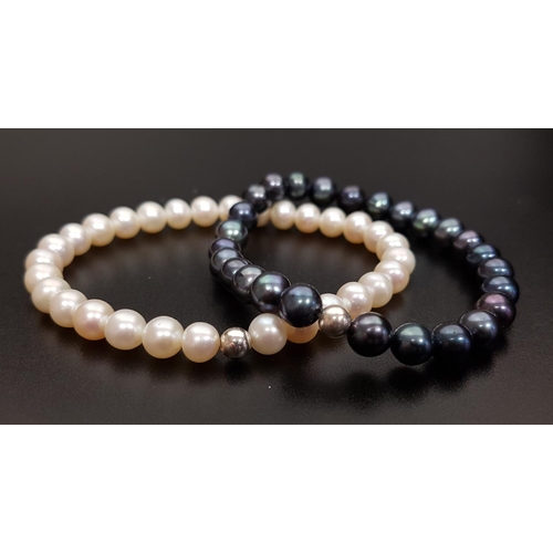 93 - PAIR OF FRESHWATER PEARL BRACELETS
one with black pearls and the other white pearls, both on elastic... 