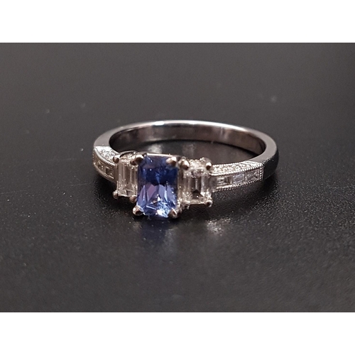125 - IMPRESSIVE TANZANITE AND DIAMOND RING
the central radiant cut tanzanite approximately 0.45cts, flank... 