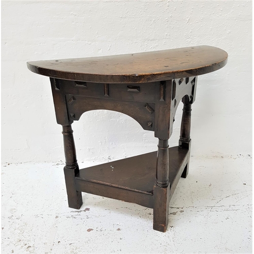 113 - OAK CREDENCE TABLE
with a D shaped top above an arched frieze, standing on three turned supports uni... 