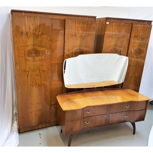 115 - BEAUTILITY WALNUT BEDROOM SUITE
comprising a shaped mirror back dressing table with a breakfront bas... 