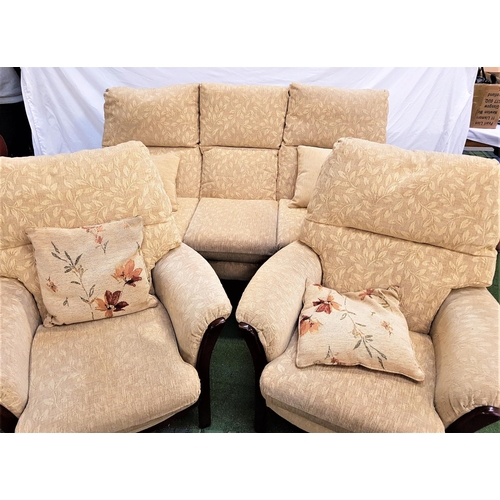 120 - THREE PIECE SUITE
with a dark stained frame, comprising a three seat sofa and two armchairs, all wit... 