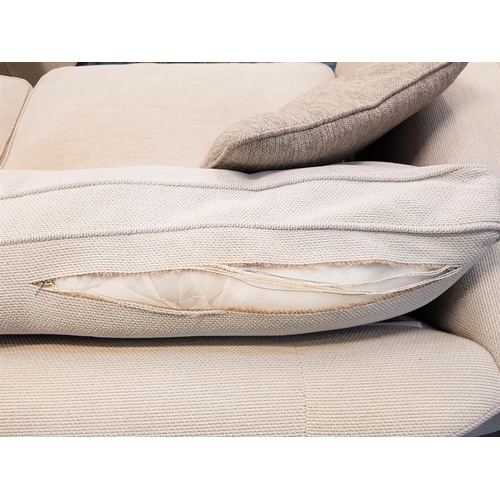 141 - PAIR OF LARGE THREE SEAT SOFAS
in textured cream fabric with two mushroom coloured scatter cushions ... 