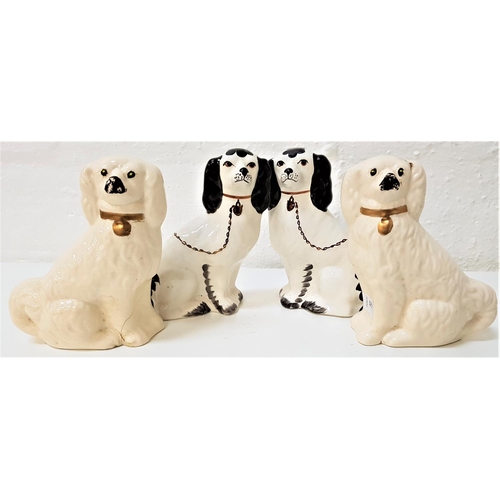 195 - TWO PAIRS OF WALLY DOGS
one cream ground with gold collars, 21cm high, the other black and white, 21... 