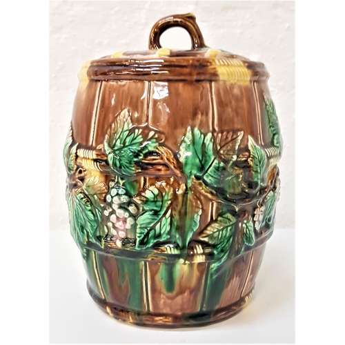 207 - VICTORIAN MAJOLICA BISCUIT BARREL
with vines and leaf relief decoration, the circular lid with a bra... 