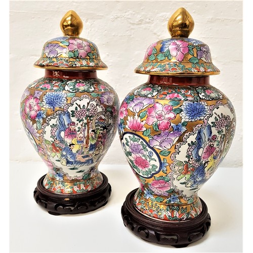 200 - PAIR OF CHINESE FAMILLE ROSE LIDDED GINGER JARS
decorated with panels of figures and fauna, 31.5cm h... 