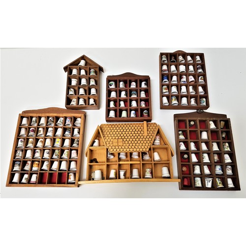 292 - SELECTION OF SOUVENIOR THIMBLES
contained in six partitioned wood cases, approximately 132