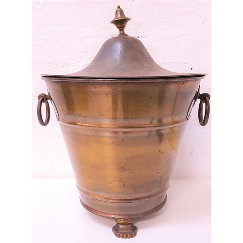 299 - CIRCULAR COPPER COAL BIN
of tapering form with side carrying handles, raised on three lion feet, the... 