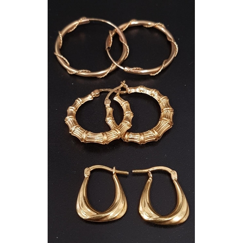 97 - THREE PAIRS OF NINE CARAT GOLD HOOP STYLE EARRINGS
one pair with bamboo effect decoration, and anoth... 