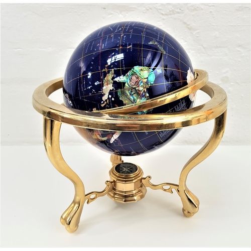 308 - HARD STONE TERRESTRIAL GLOBE
inlaid with semi precious stones to a blue ground, raised on a gilt bra... 