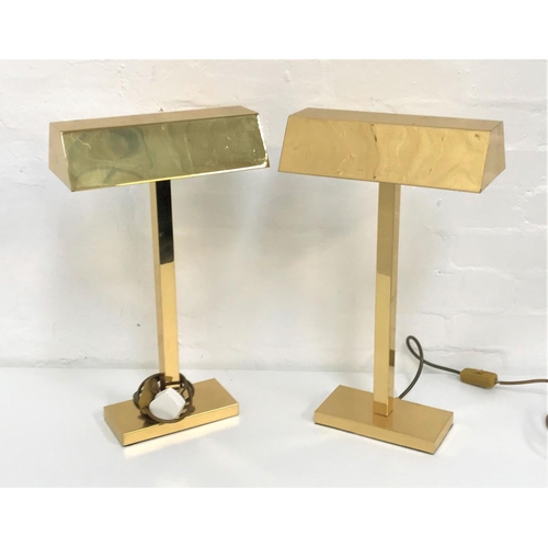 493 - TWO BRASS TABLE LIGHTS
with oblong shaped hoods raised on a square column and oblong base, 50cm high... 