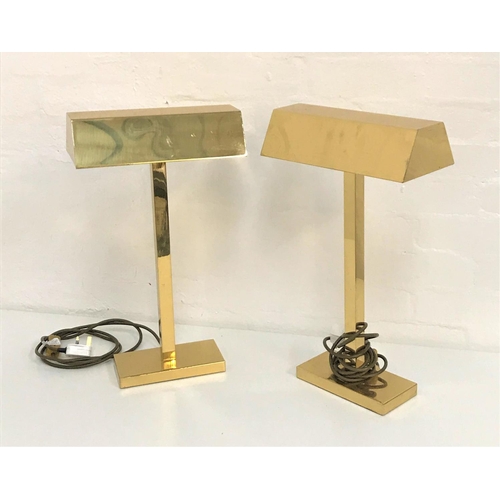 495 - TWO BRASS TABLE LIGHTS
with oblong shaped hoods raised on a square column and oblong base, 50cm high... 