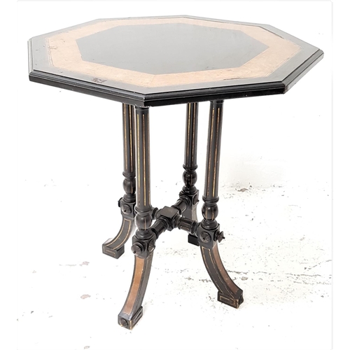 457 - VICTORIAN AESTHITIC MOVEMENT AMBOYNA AND EBONISED OCTAGONAL TABLE
standing on four columns with outs... 